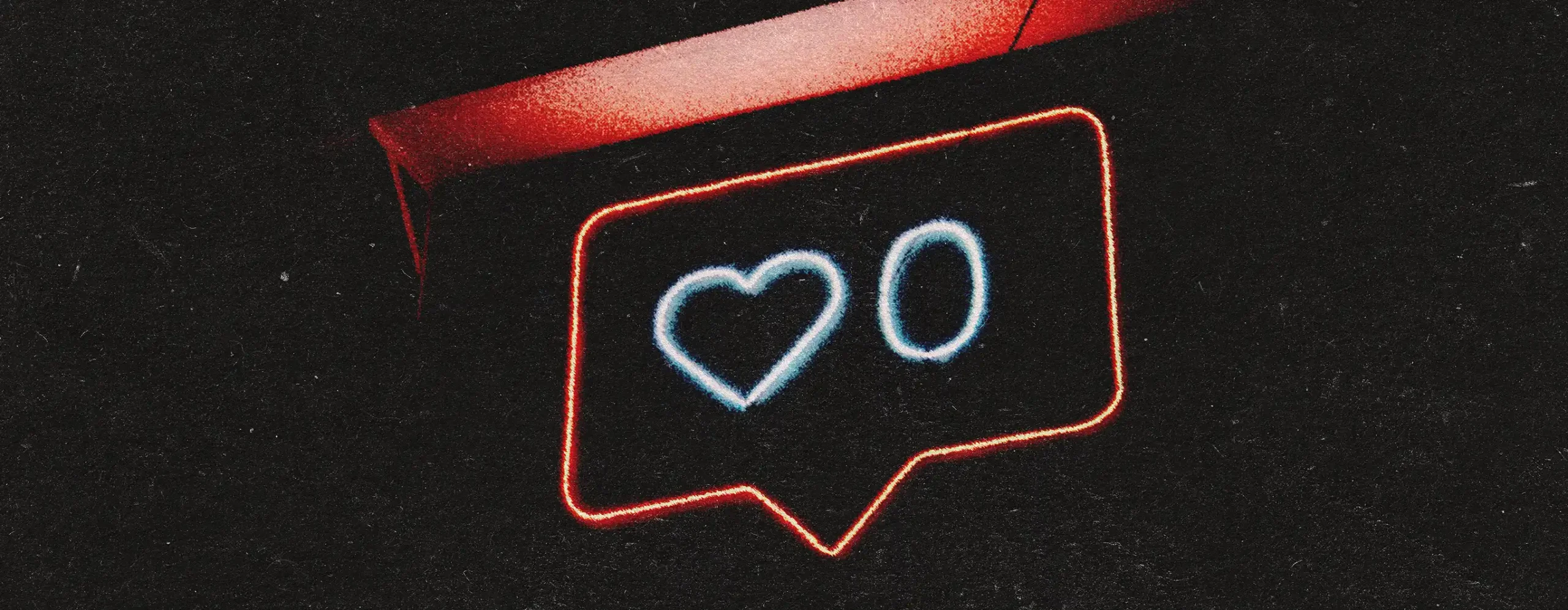 Outdoor neon sign of a comment icon with a heart and a zero in it