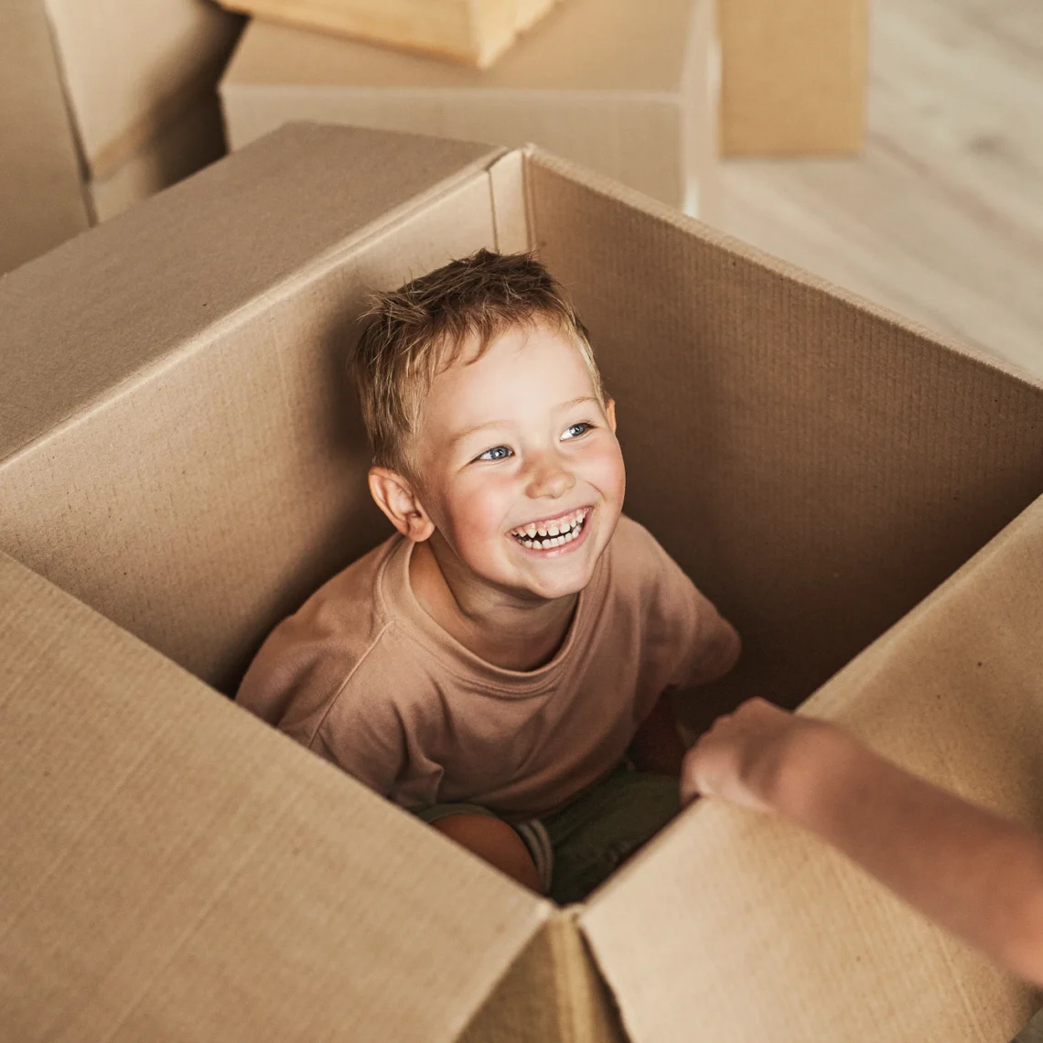 Boy Smiling In Box